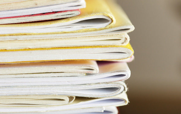 A pile of folders and documents